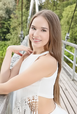 Sasha Quinn Smiling Playfully As Her Short Skirt Flips Up To Reveal She’s Not Wearing Panties